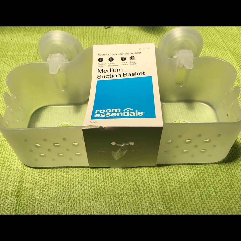 Clear shower shelf/holder.
